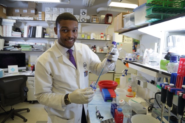Photo of male African-American researcher in lab