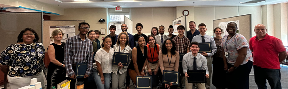 Students from the NIH Summer Internship Program and the NIDCR Summer Dental Student Award program presented their research at a poster session.