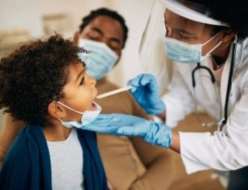 A child being examined by a doctor.