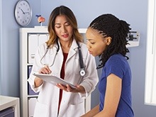 A health professional is consulting with a patient.